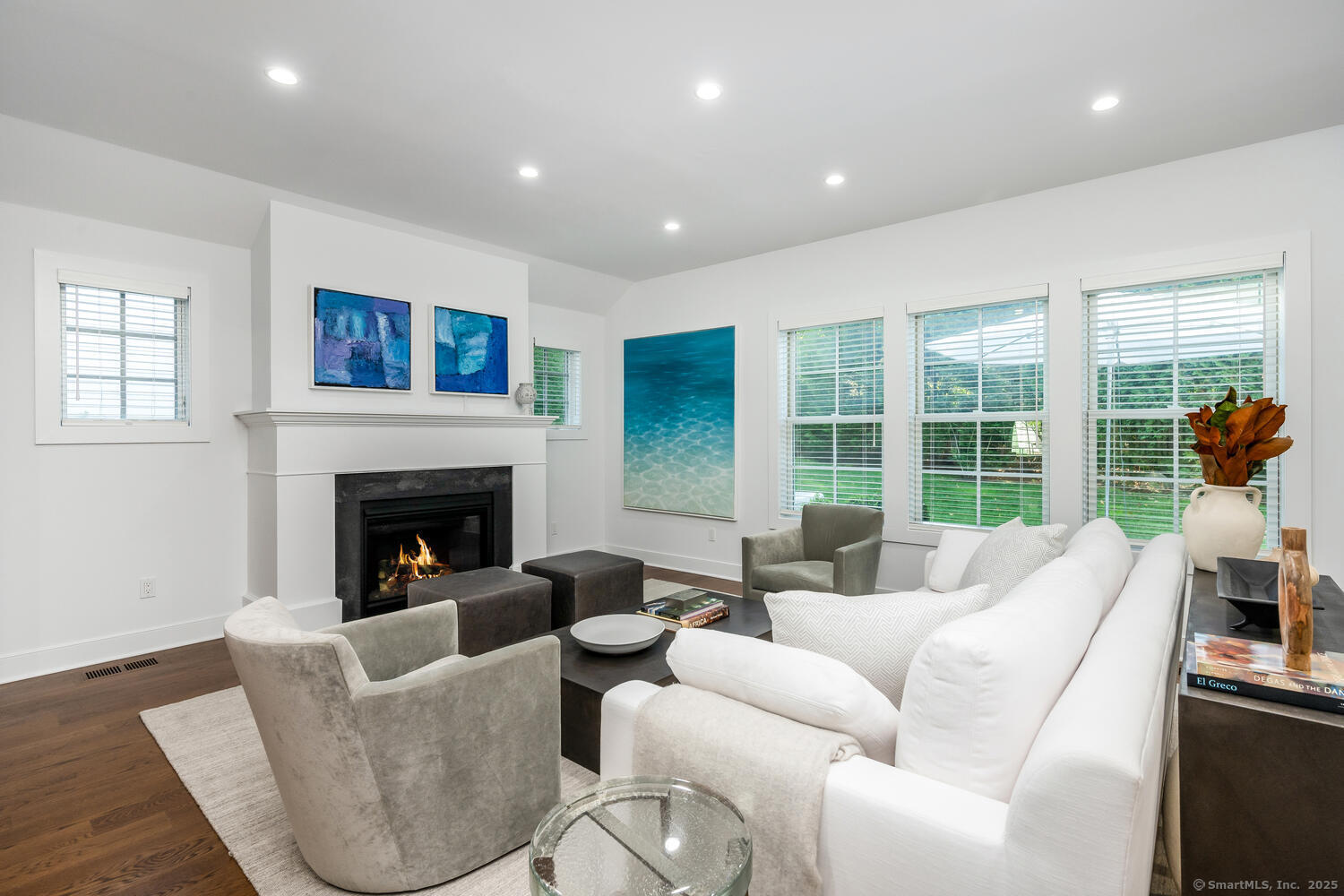 72 Kensett Lane Darien, CT 06820 - Photo 12 of 39 a living room with furniture and a fireplace