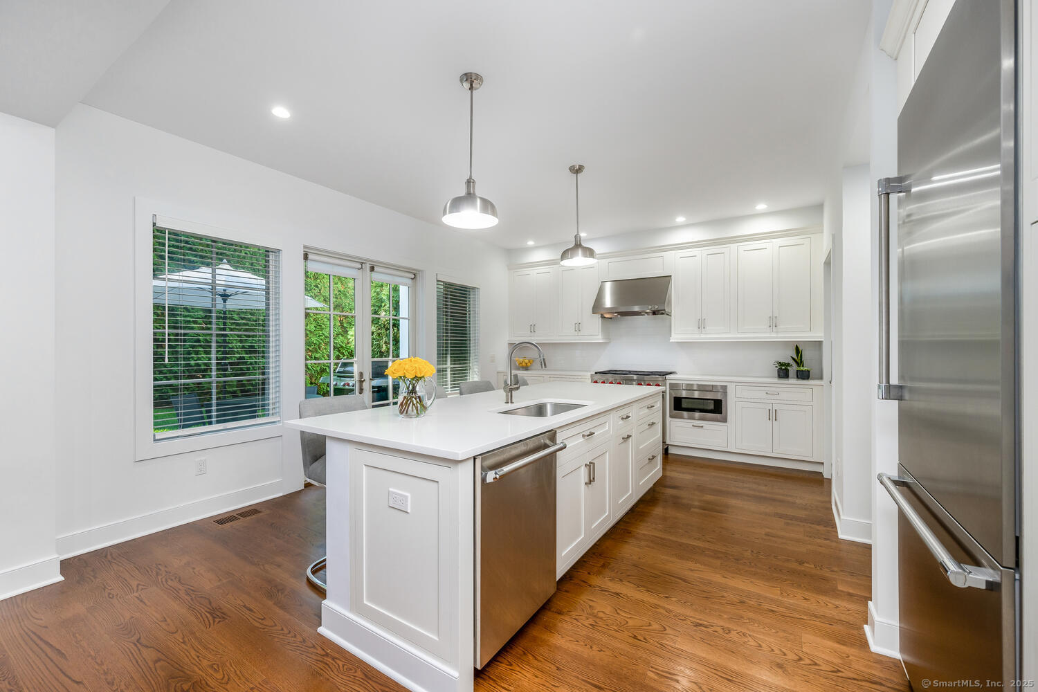 72 Kensett Lane Darien, CT 06820 - Photo 14 of 39 a kitchen with stainless steel appliances granite countertop a sink stove and refrigerator