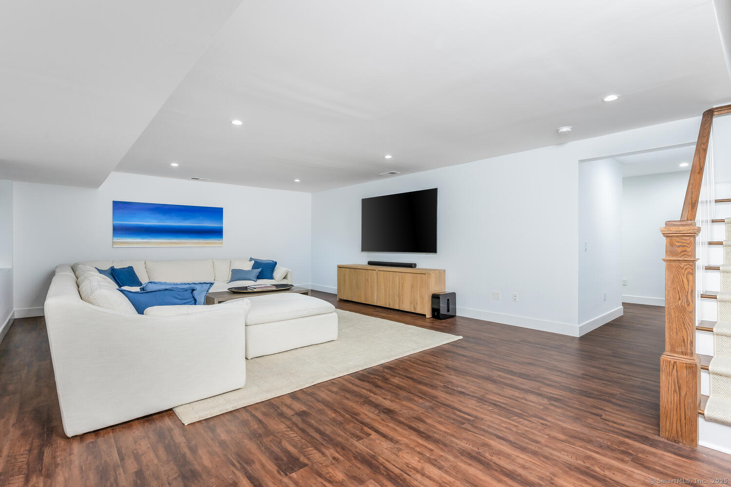 72 Kensett Lane Darien, CT 06820 - Photo 28 of 39 a living room with furniture and a flat screen tv