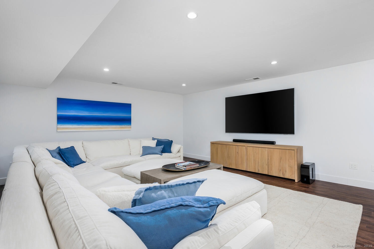 72 Kensett Lane Darien, CT 06820 - Photo 29 of 39 a living room with furniture and a flat screen tv