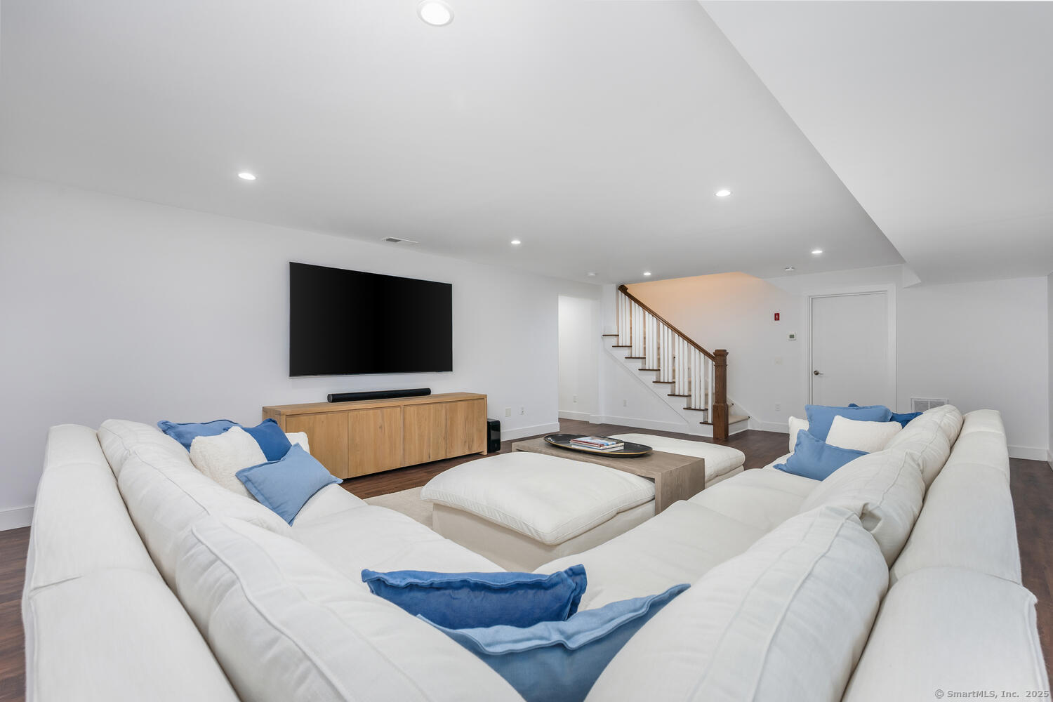 72 Kensett Lane Darien, CT 06820 - Photo 30 of 39 a living room with furniture and a flat screen tv