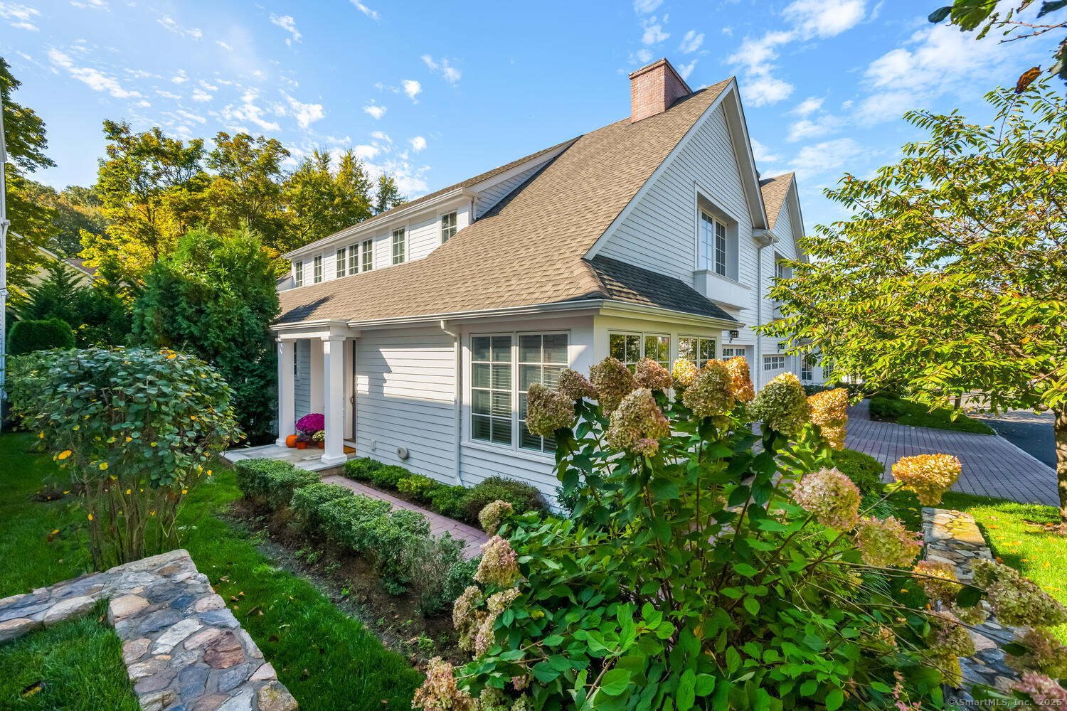 72 Kensett Lane Darien, CT 06820 - Photo 3 of 39 a view of a house with a yard and garden