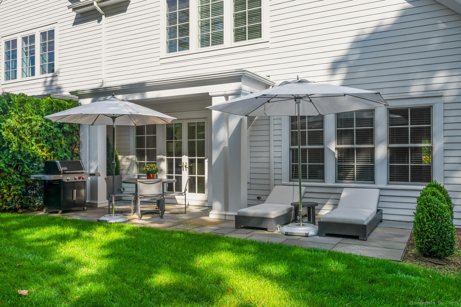 72 Kensett Lane Darien, CT 06820 - Photo 37 of 39 a front view of a house with patio