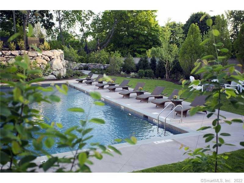 72 Kensett Lane Darien, CT 06820 - Photo 39 of 39 a view of swimming pool with lawn chairs and plants