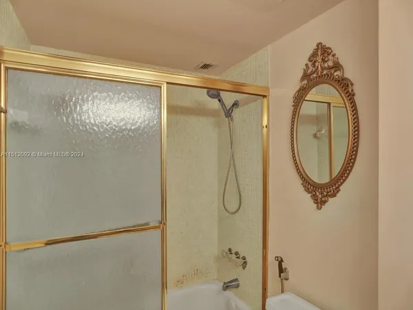 a view of a balcony with an outdoor seating