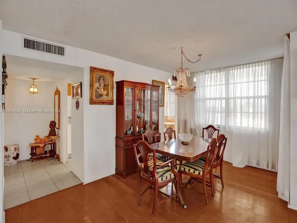 a view of a dining room with furniture and window