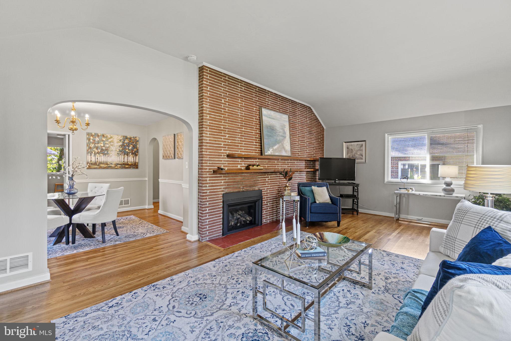 9505 Saginaw Street Silver Spring, MD 20901 - Photo 5 of 35 The main floor fireplace is gas with lovely brick