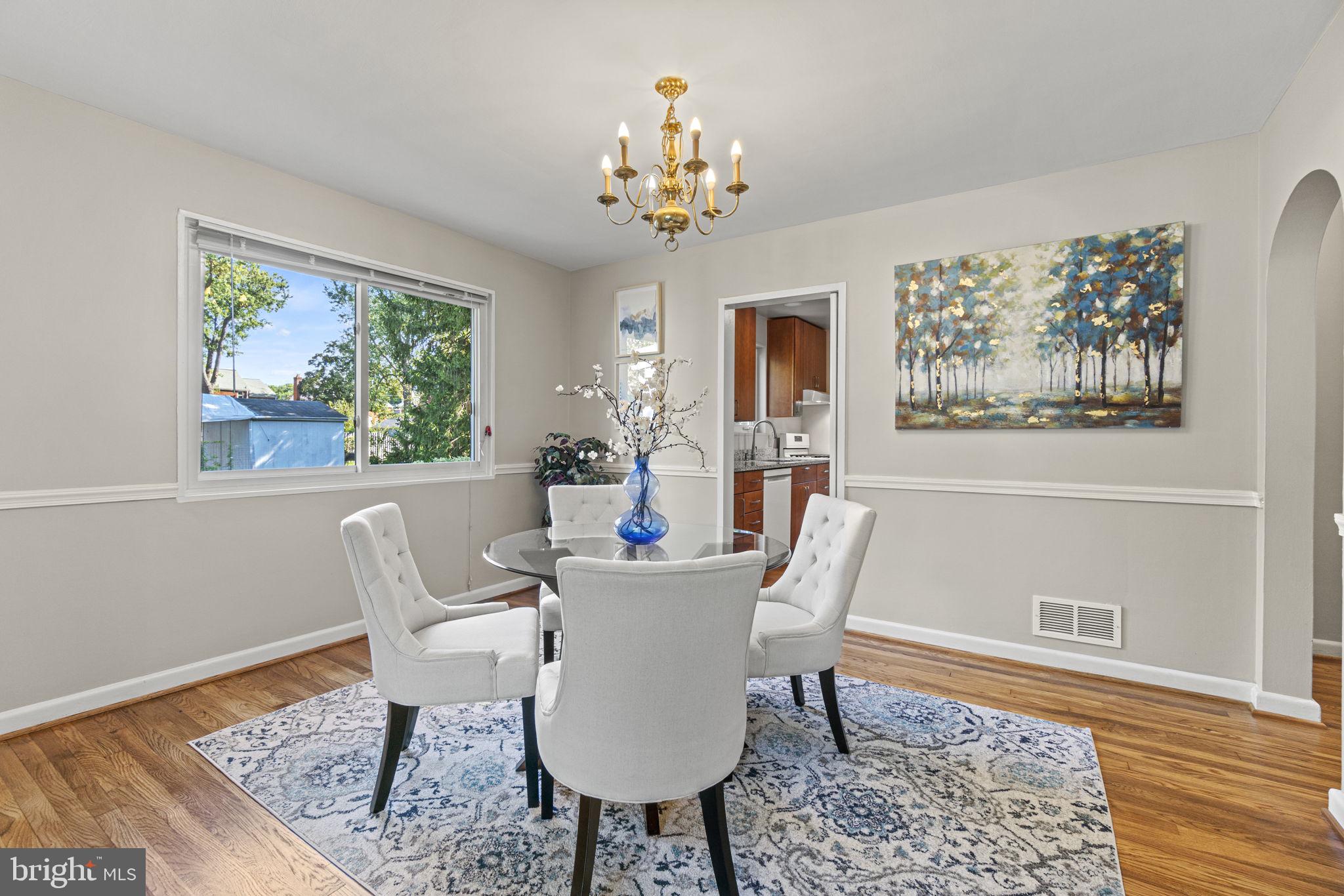 9505 Saginaw Street Silver Spring, MD 20901 - Photo 7 of 35 An oversized dining room with gorgeous hw floors