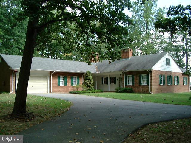 27 Old South River Road Edgewater, MD 21037 - Photo 18 of 30 a front view of a house with a garden