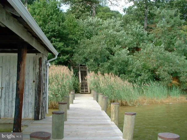 a view of terrace with seating space and lake view