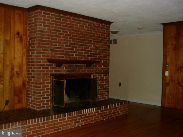 27 Old South River Road Edgewater, MD 21037 - Photo 25 of 29 a view of empty room with wooden floor and fireplace