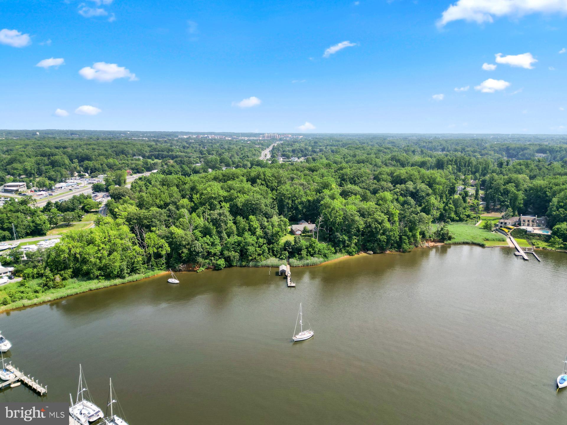 27 Old South River Road Edgewater, MD 21037 - Photo 3 of 29 a view of a lake with a houses