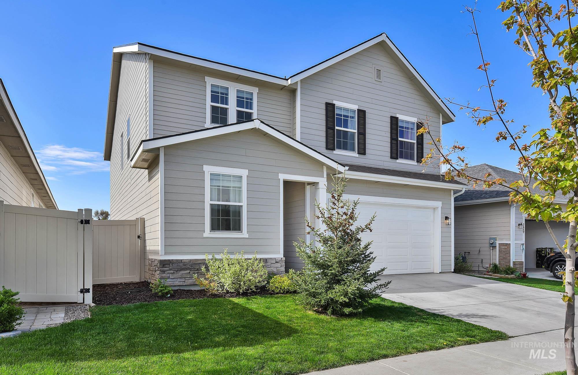 717 West Lyra Street Meridian, ID 83642 - Photo 2 of 50 Two-story residence featuring light gray siding with white trim