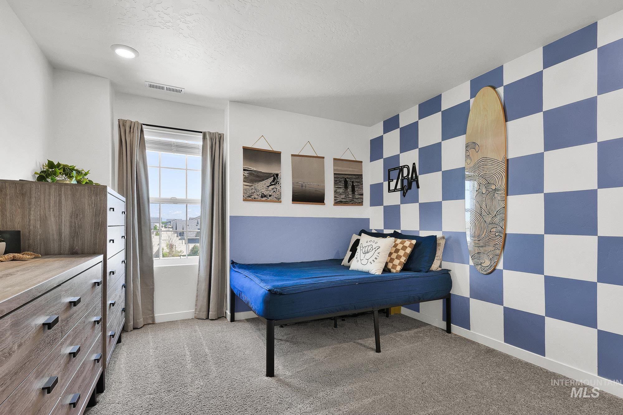 717 West Lyra Street Meridian, ID 83642 - Photo 35 of 50 Bedroom featuring neutral carpet flooring, recessed lighting, and a large window with white trim