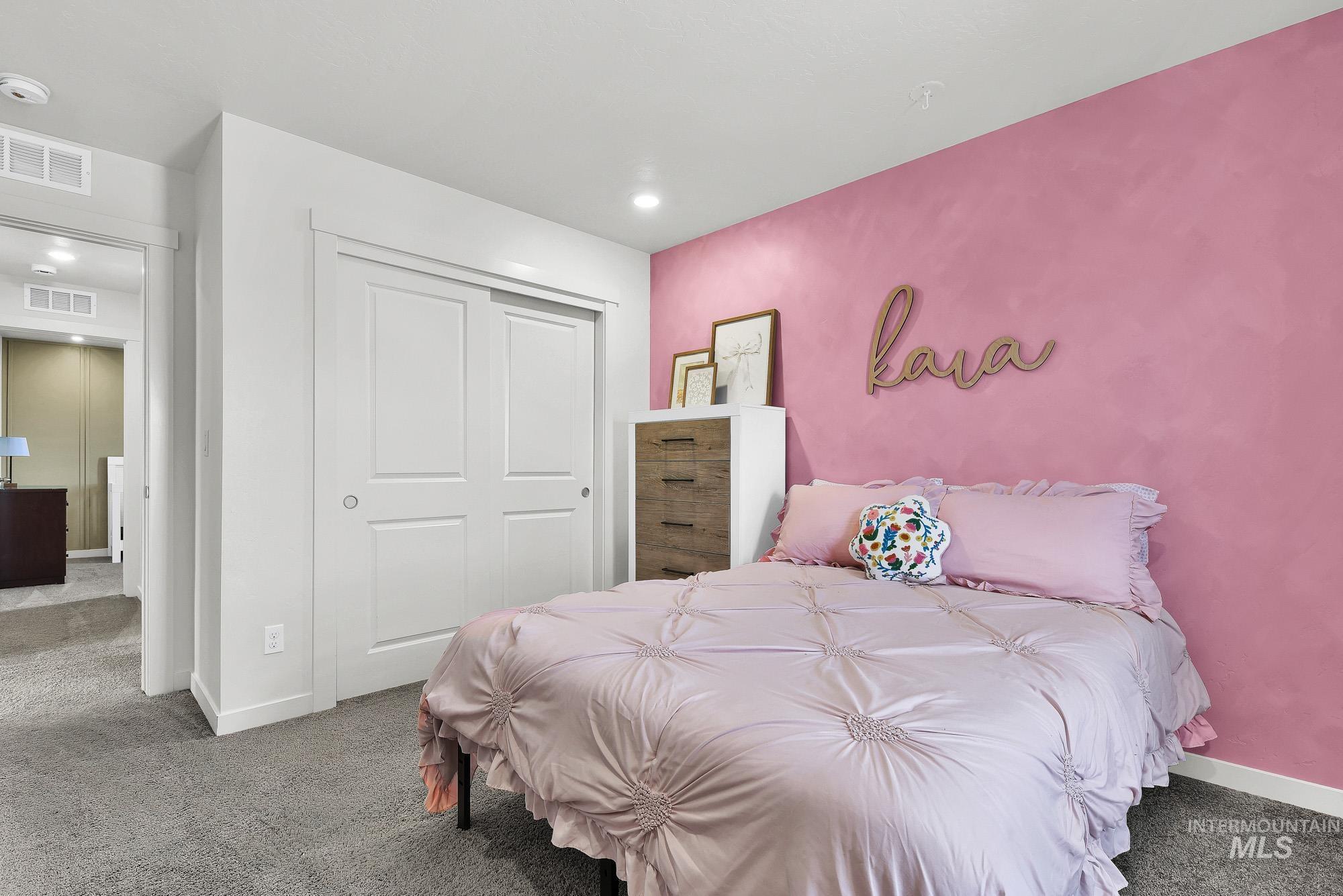 717 West Lyra Street Meridian, ID 83642 - Photo 38 of 50 Bedroom featuring a pink accent wall, recessed lighting, and grey carpet flooring