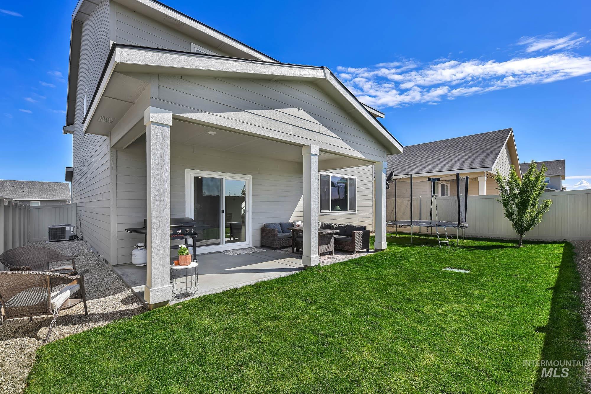 717 West Lyra Street Meridian, ID 83642 - Photo 44 of 50 Covered concrete patio with sliding glass door access