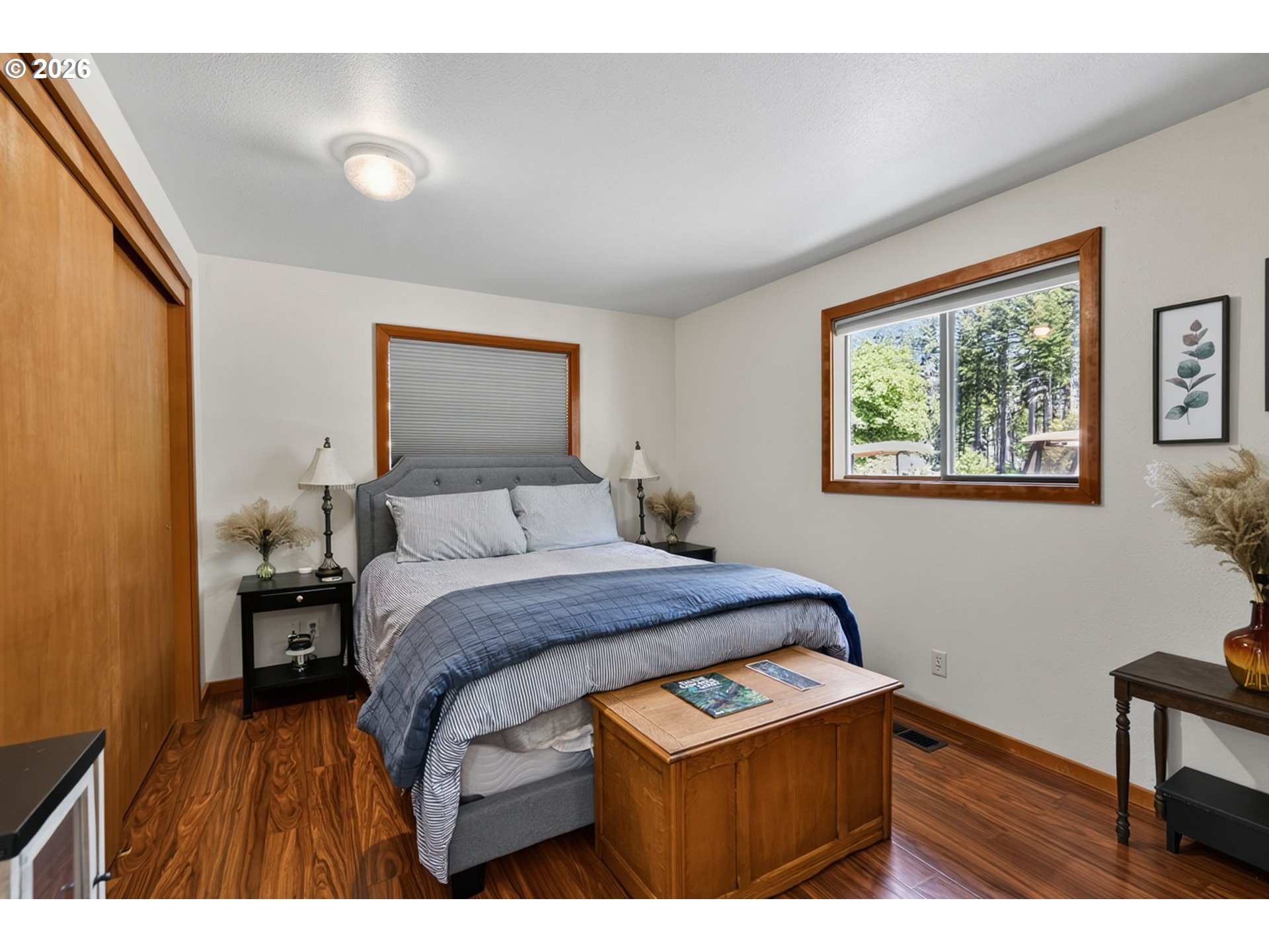 46725 Goodpasture Road Vida, OR 97488 - Photo 34 of 48 a bed room with a bed and a painting on the wall