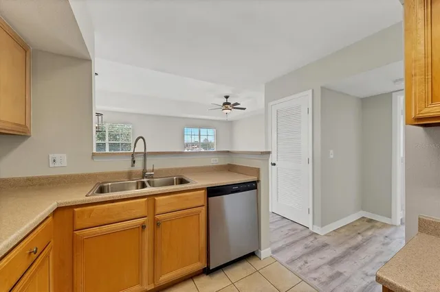 a kitchen with a sink and cabinets