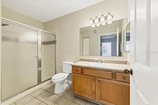 a bathroom with a sink toilet and a mirror