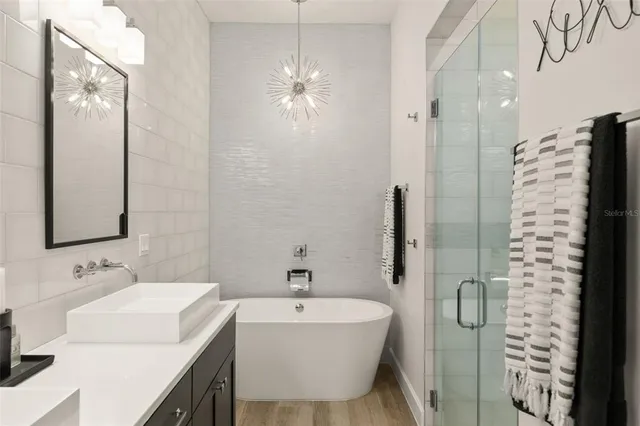 a bathroom with a bathtub and shower