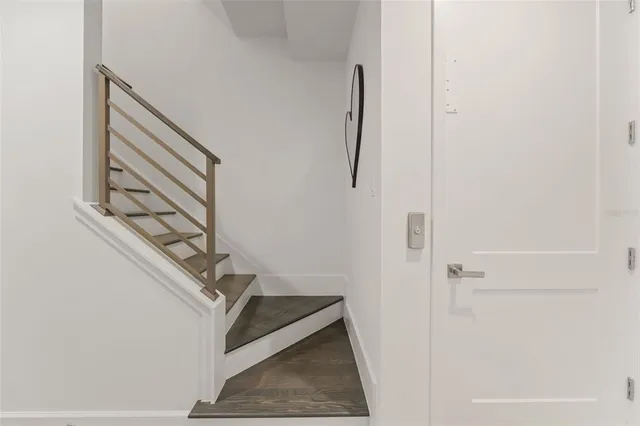 a view of staircase with white walls