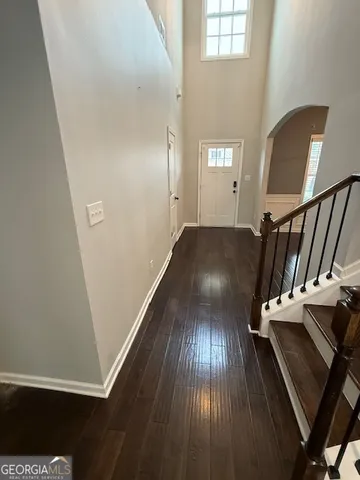 a view of entryway with wooden floor