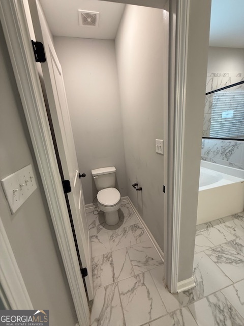 123 Weeping Moss Way Kathleen, GA 31047 - Photo 15 of 34 a bathroom with a sink and a toilet