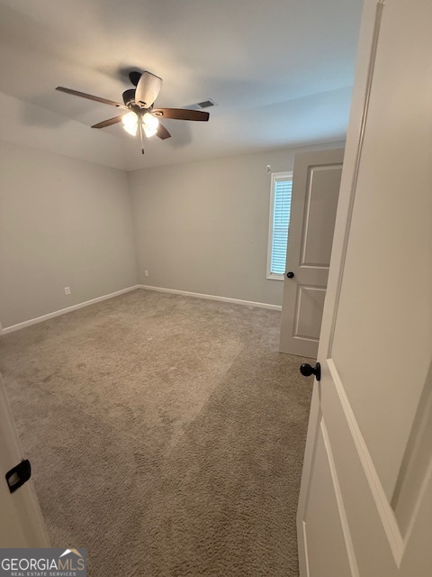 123 Weeping Moss Way Kathleen, GA 31047 - Photo 22 of 34 an empty room with windows and fan