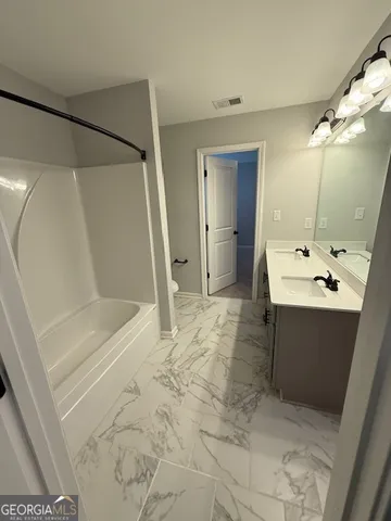 a view of a big room with carpet