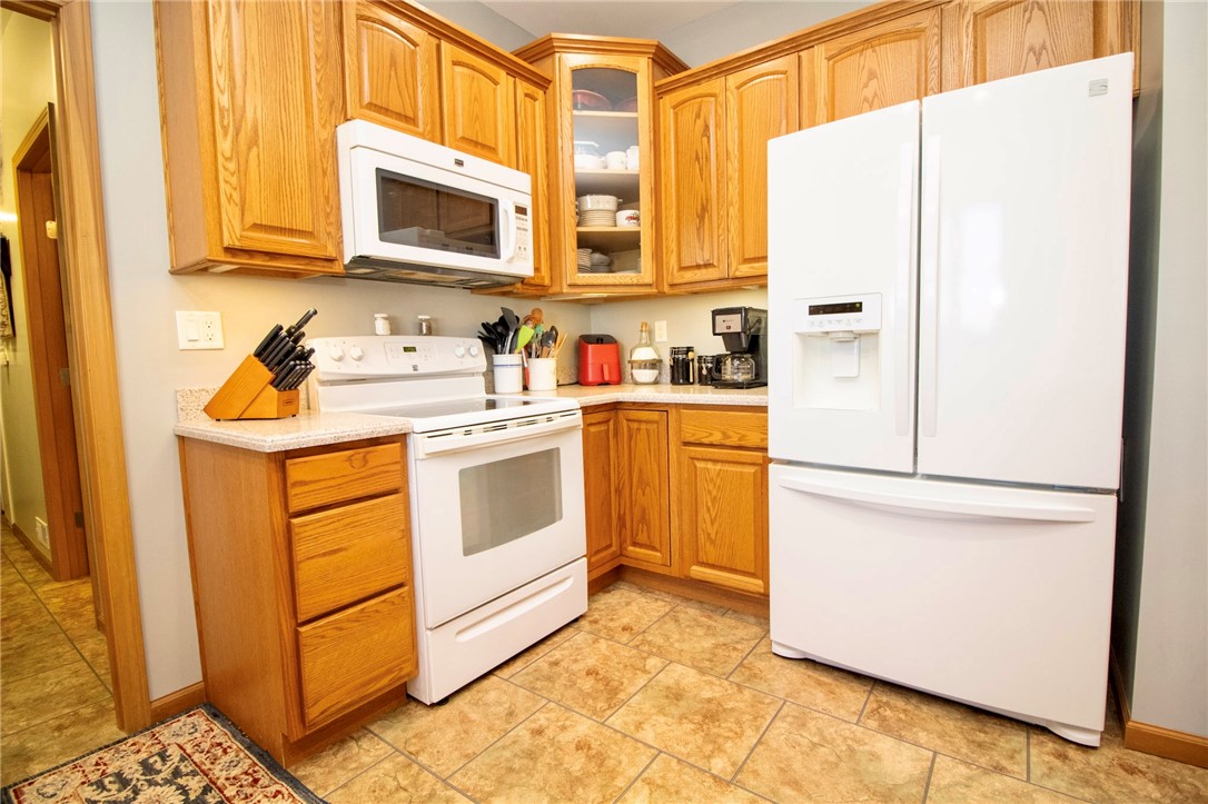 1000 Stone Road Xenia, OH 45385 - Photo 10 of 39 This kitchen offers functionality and comfort with essential appliances.