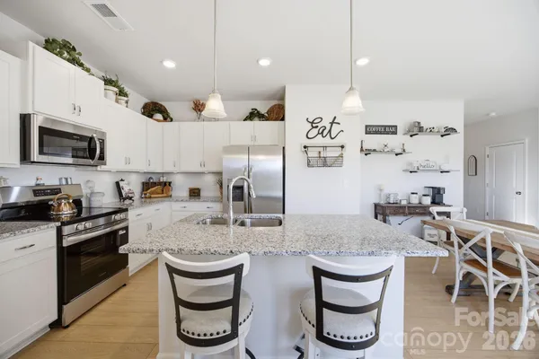 a kitchen with lots of counter space and appliances