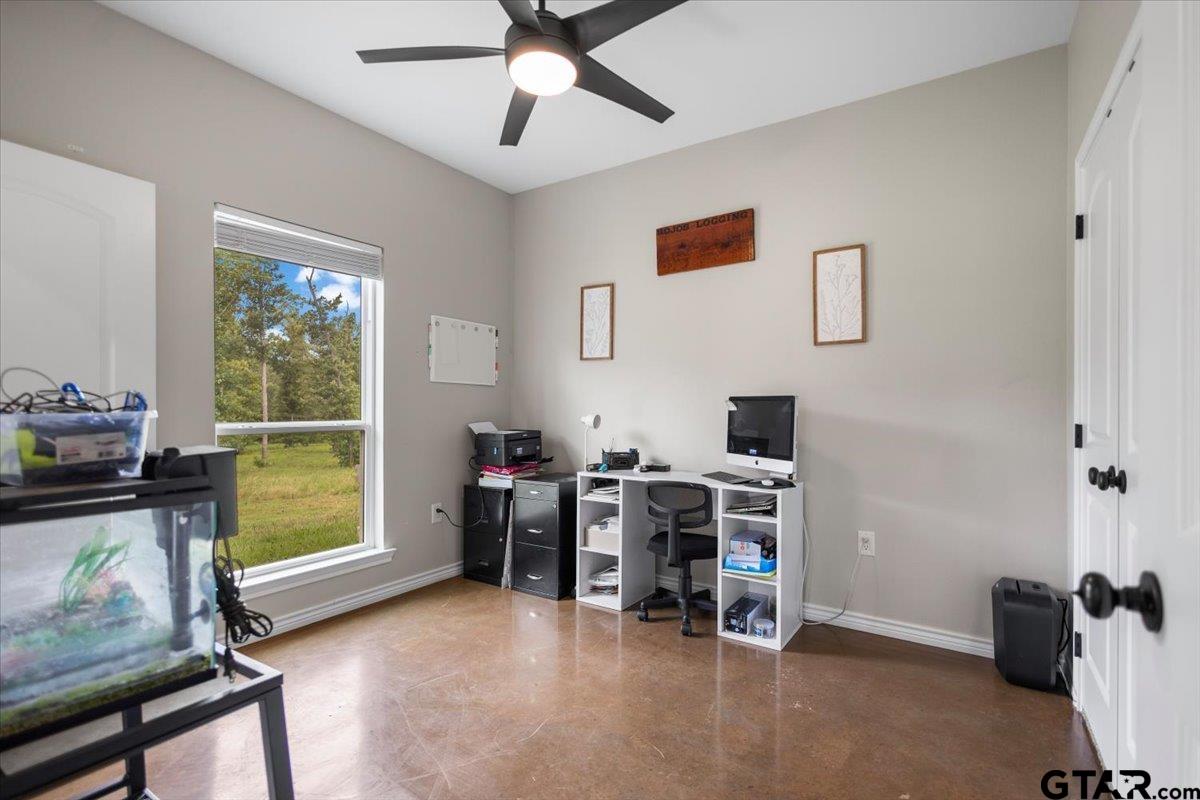 9235 Farm To Market Road 851 Rusk, TX 75785 - Photo 27 of 47 a view of a workspace with furniture and a window