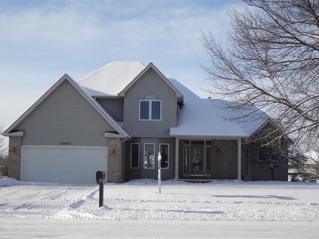 13336 Round Barn Road Plainfield, IL 60585 - Photo 1 of 25 a front view of a house with garage