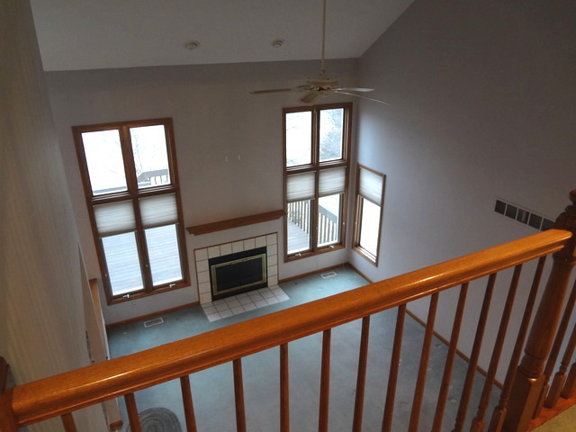 13336 Round Barn Road Plainfield, IL 60585 - Photo 18 of 25 a view of a porch with wooden floor and fireplace