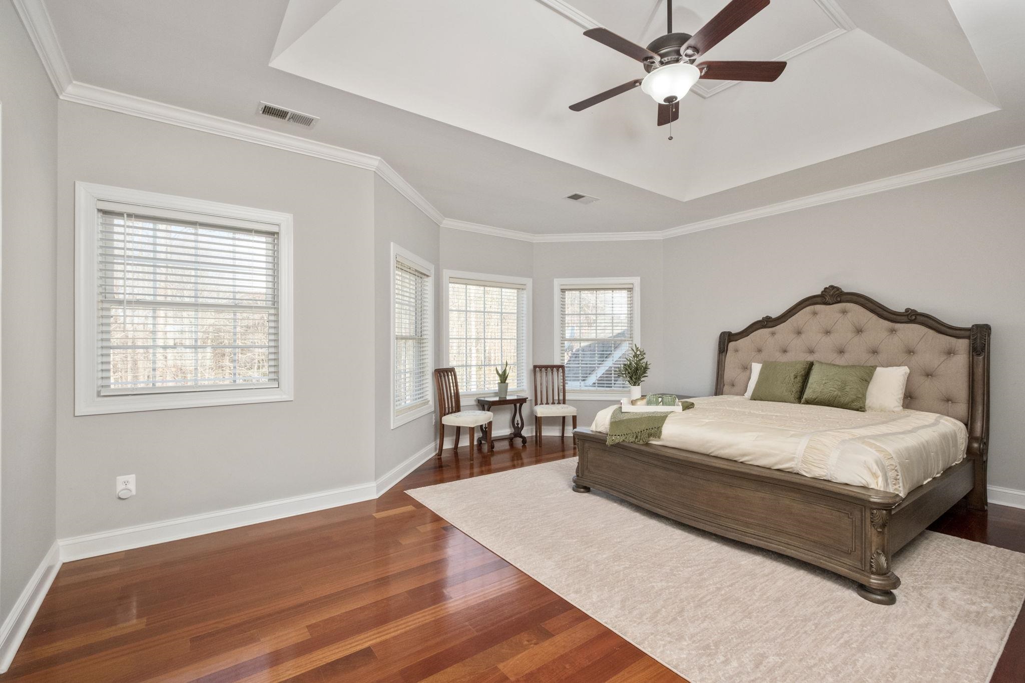 909 Hancock Drive Ruckersville, VA 22968 - Photo 24 of 68 a spacious bedroom with a bed a table and windows