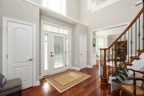 a view of balcony with wooden floor and fence