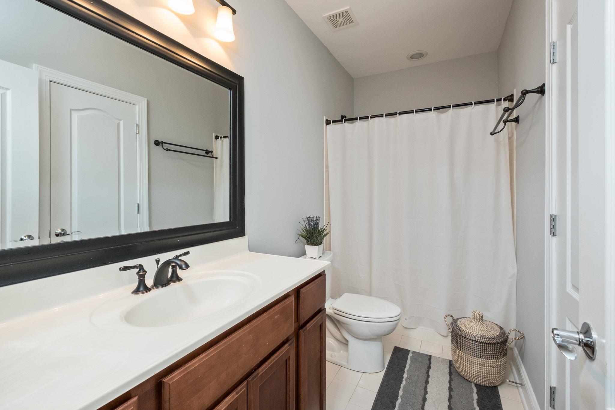 909 Hancock Drive Ruckersville, VA 22968 - Photo 44 of 68 a bathroom with a sink and a mirror
