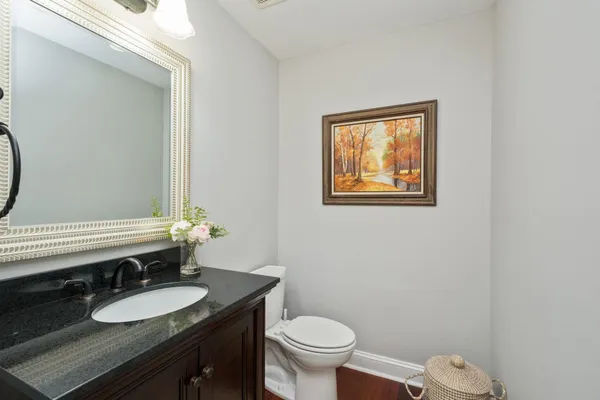 a view of a swimming pool with a table chairs and a backyard