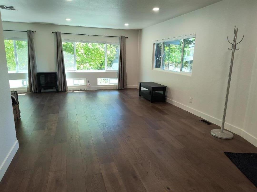 552 Bean Creek Road, Unit 126 Scotts Valley, CA 95066 - Photo 7 of 34 wooden floor in an empty room with a window