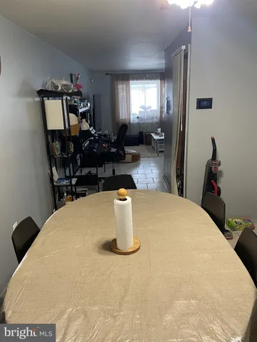 a bed sitting in a room next to a window