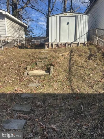 a view of a backyard of the house