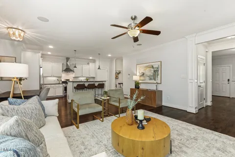 a kitchen with stainless steel appliances granite countertop a sink a stove and a refrigerator