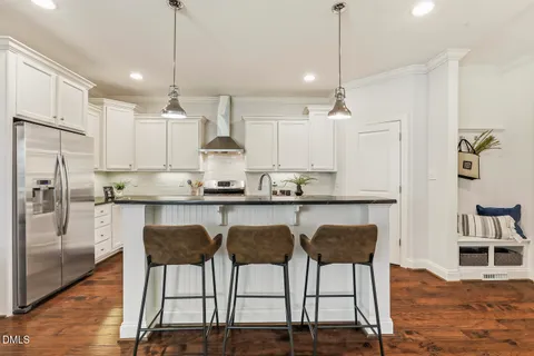 a kitchen with stainless steel appliances granite countertop a stove and a sink