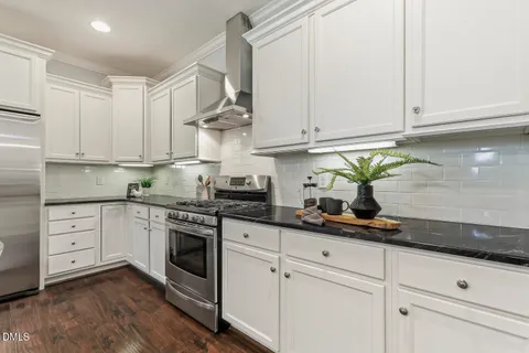 a view of a bedroom with wooden floor and closet