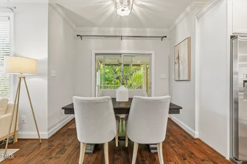 a spacious bedroom with a bed and a large window