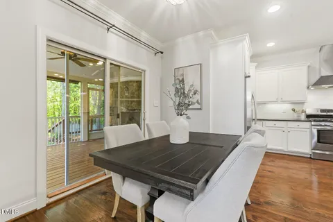 a spacious bedroom with a bed and a chandelier