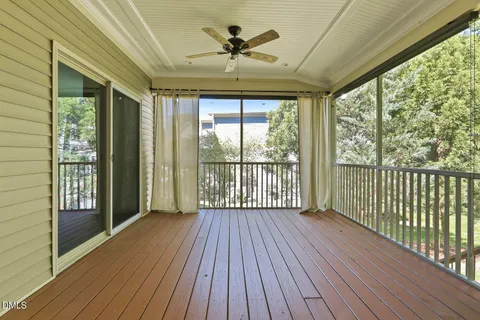 a spacious bathroom with a granite countertop sink a mirror a shower and a bathtub