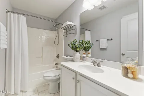 an aerial view of residential house with outdoor space and trees all around