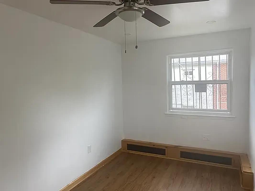 1087 Blake Avenue Brooklyn, NY 11208 - Photo 11 of 16 Empty room featuring wood finished floors and a ceiling fan