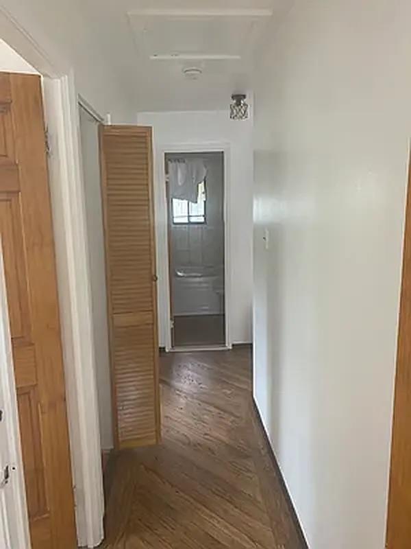 1087 Blake Avenue Brooklyn, NY 11208 - Photo 7 of 16 Corridor featuring wood finished floors